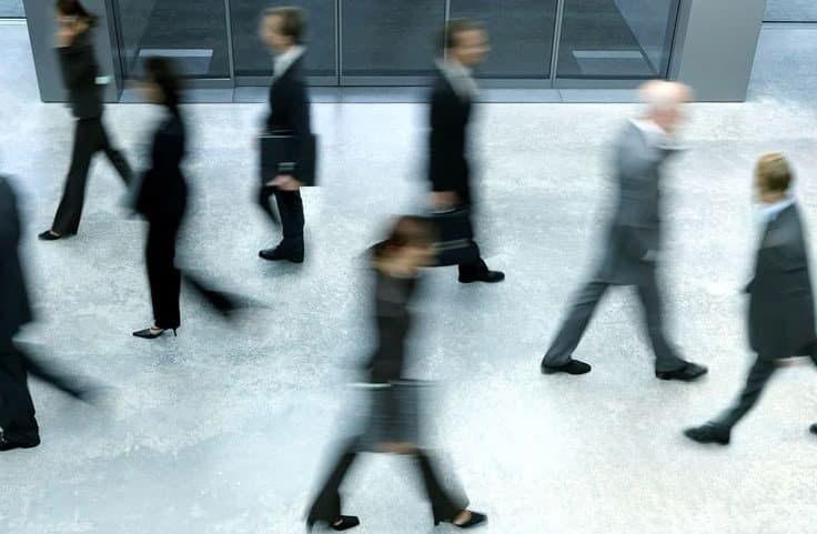 Colleagues moving through a shared workplace